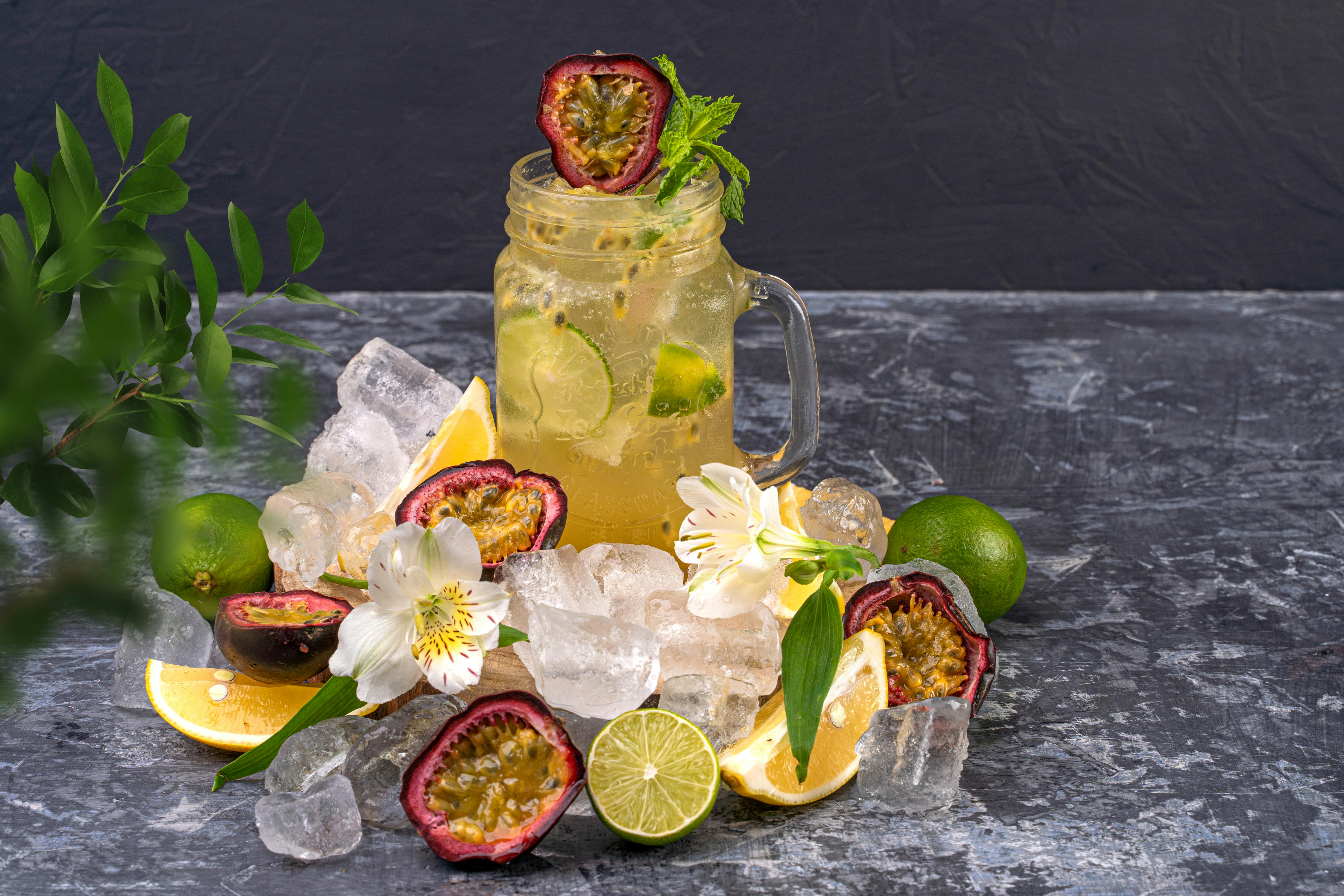 Chilled glass of passionfruit juice on crushed ice showcasing vitamin C for passionfruit gut benefits