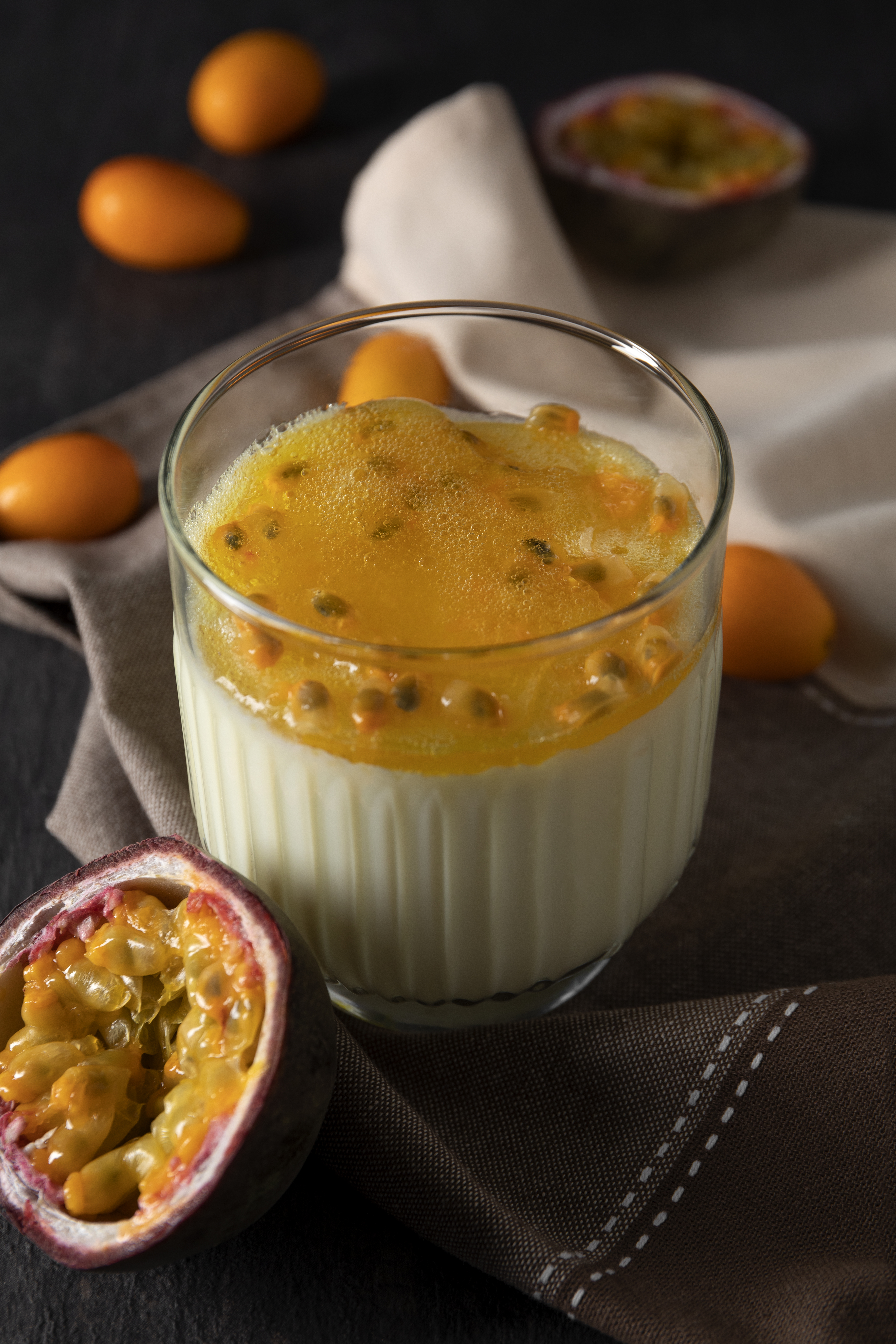 Caramelized passionfruit crème brûlée topped with seeds and golden pulp